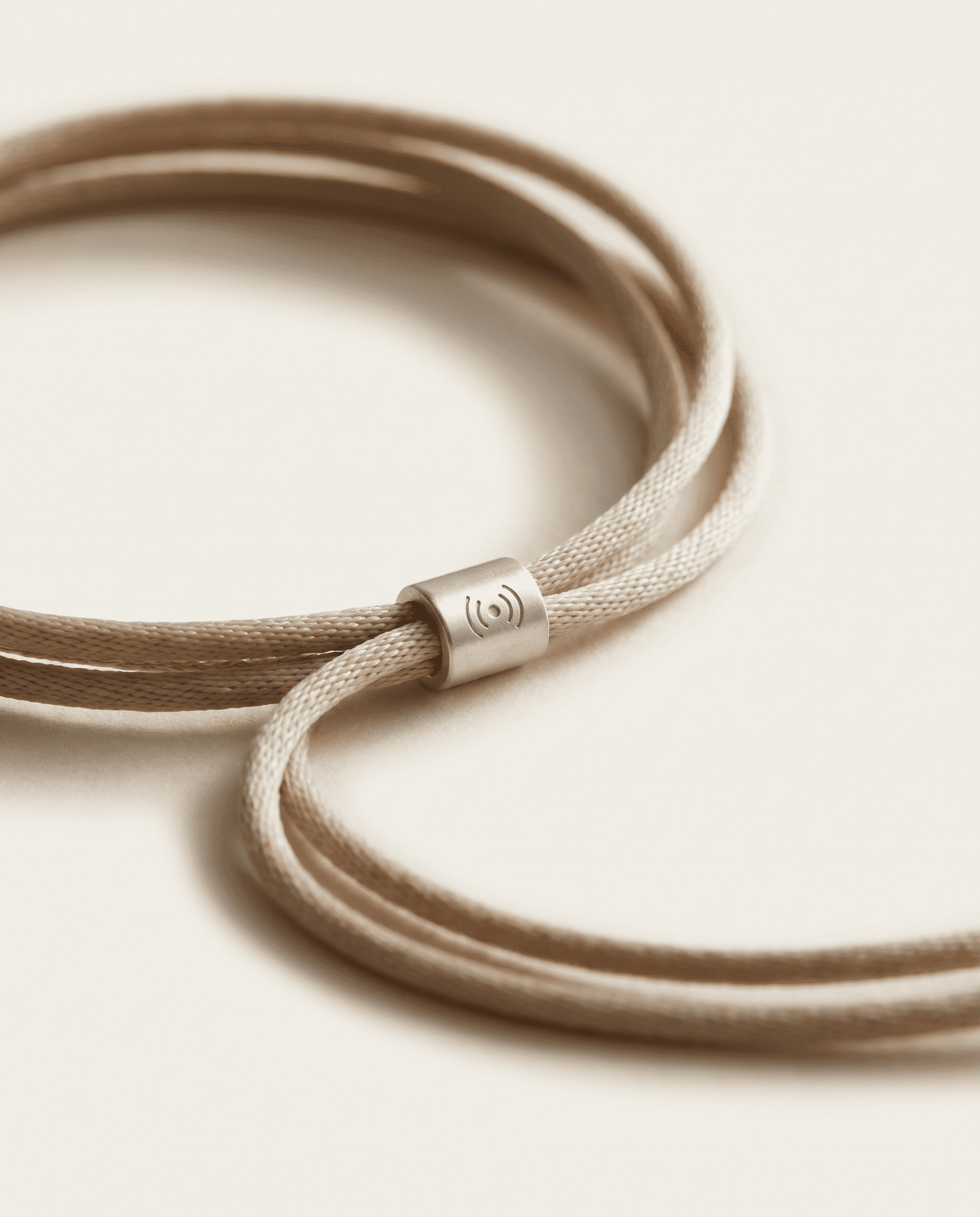 Tide Bracelet — Cord + recycled hardware. Funds 30 kg of cleanup.