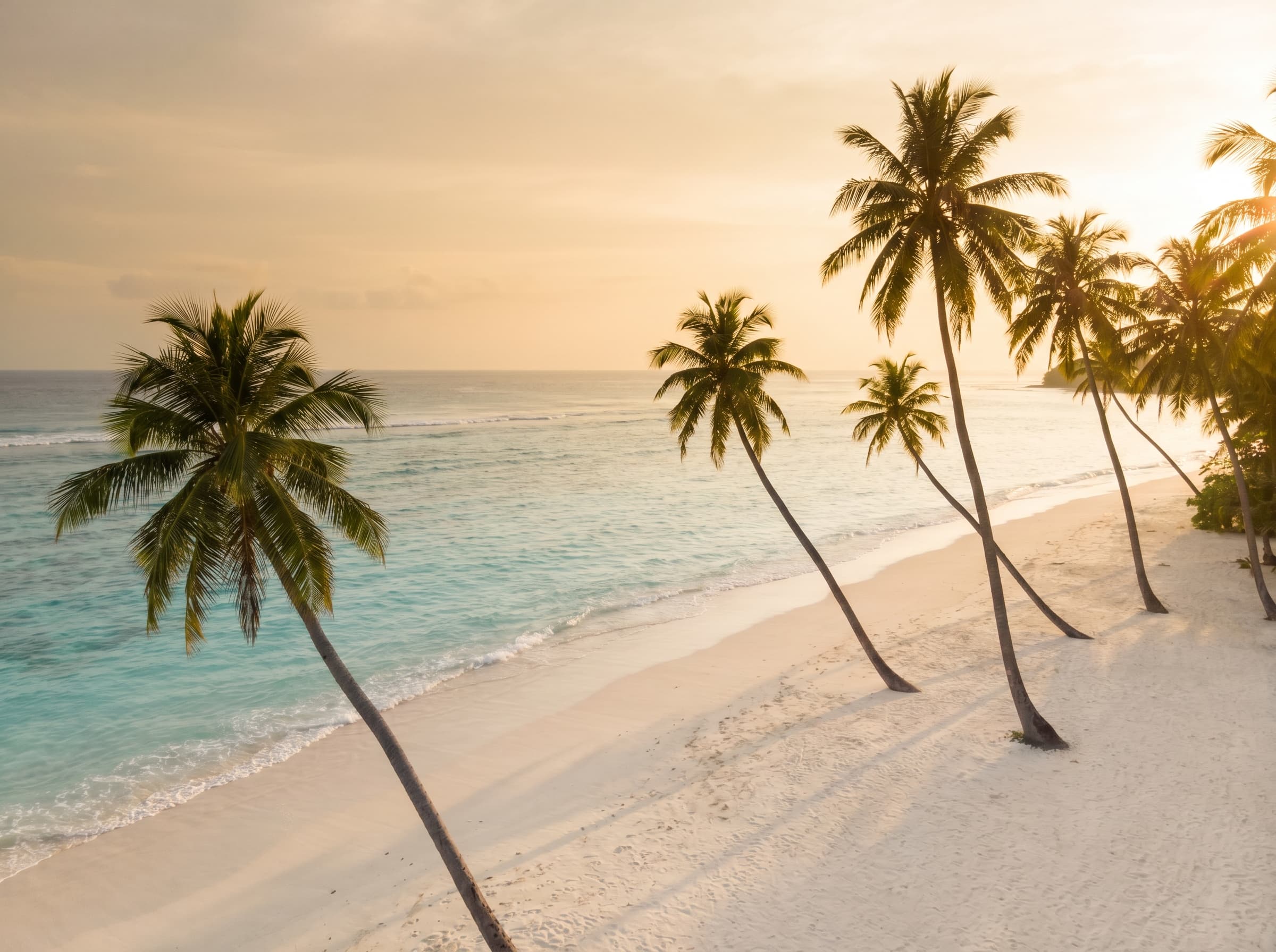 A calm Bali beach at golden hour